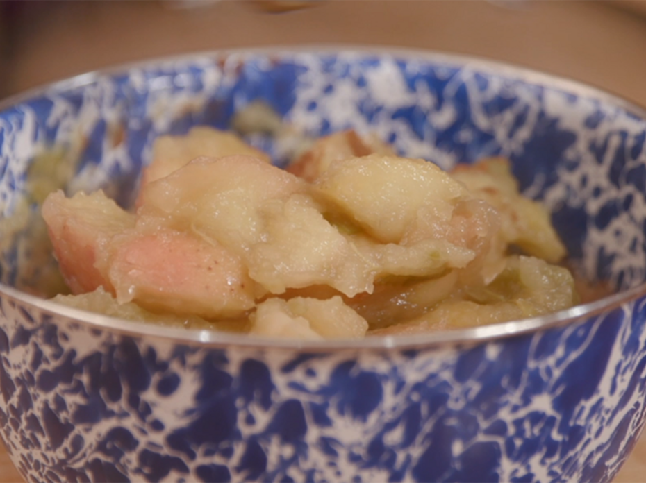 Homemade applesauce in a blue and white enamel bowl.