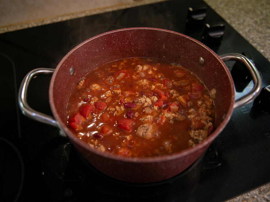 A pot of Quick Chili sits on the stove.