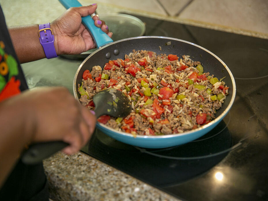 Mighthy Skillet Meal cooking in a skillet on the stove.