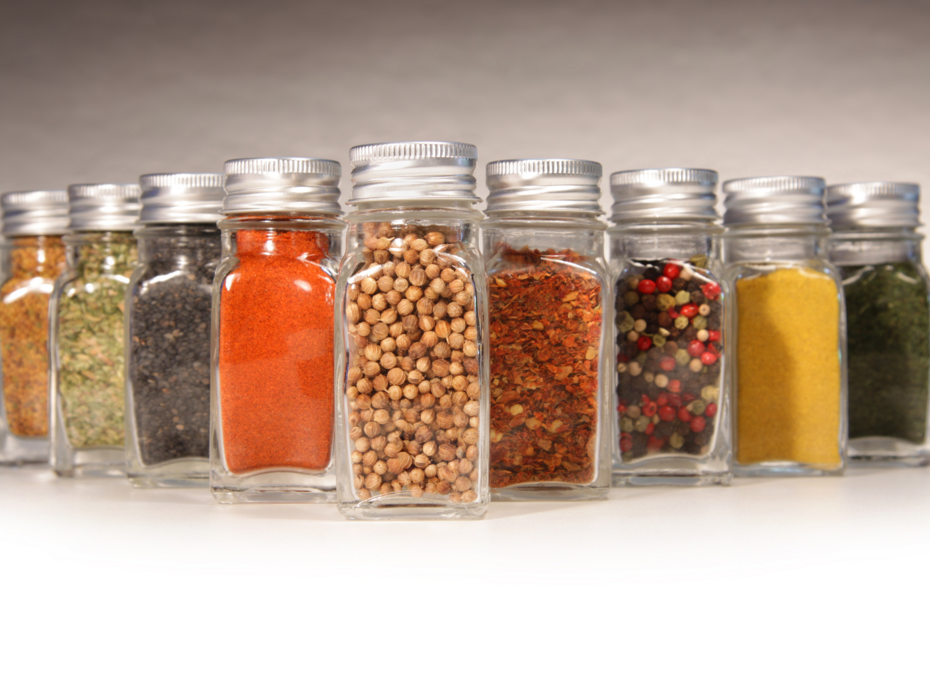 Jars of spices lined up in a V formation.