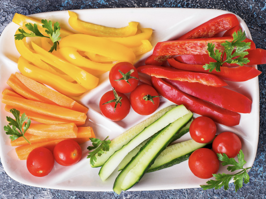 sliced bell peppers and cucumbers on a plate