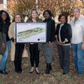Members of The Marks Project in Quitman County hold a rendering of an improved community.