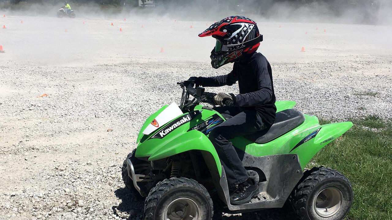 Person on a green ATV