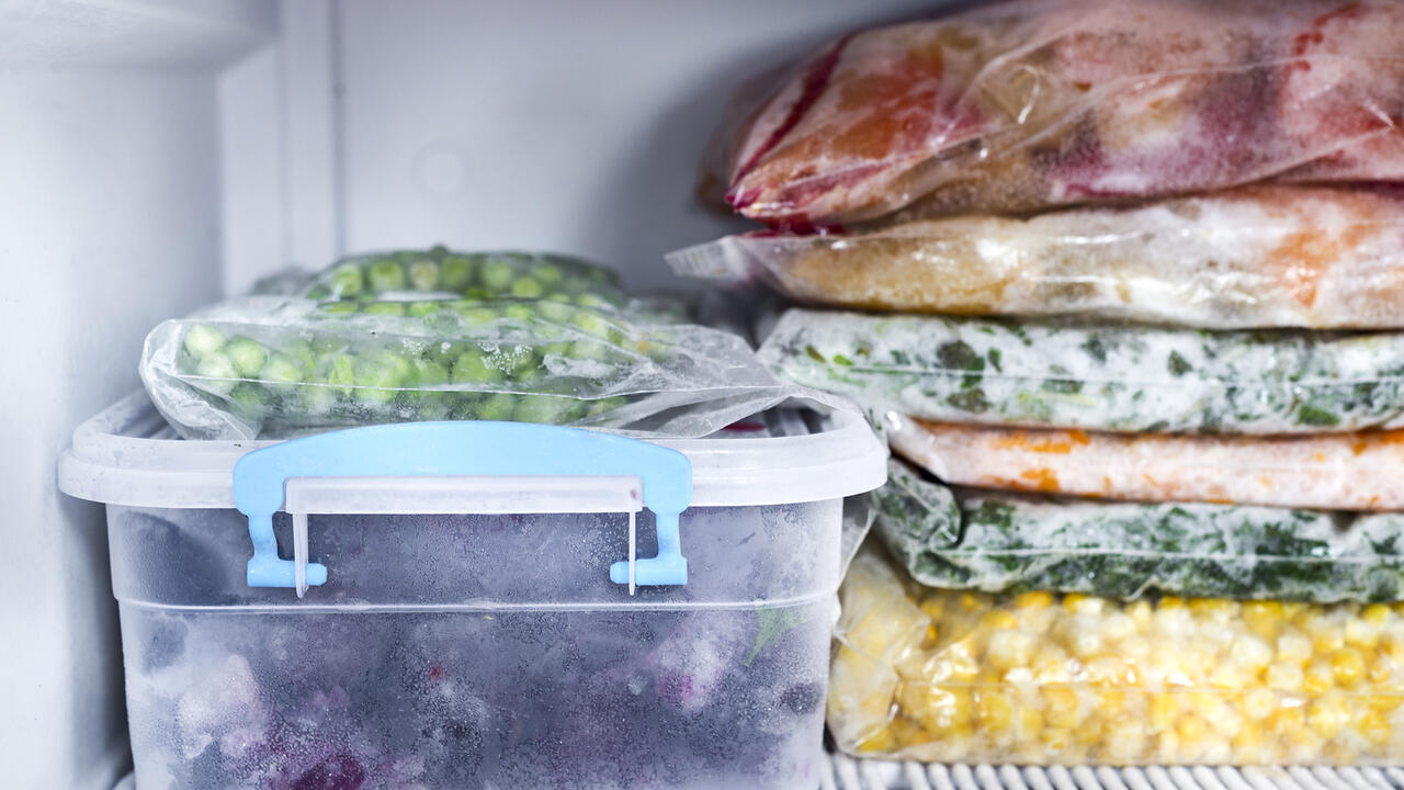 Frozen foods sit in the freezer.