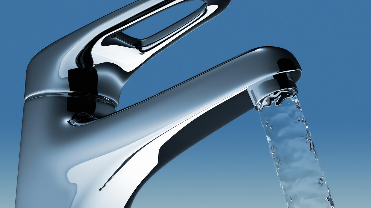 A faucet with water flowing.