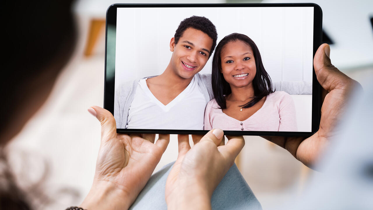 Young couple using digital tablet together