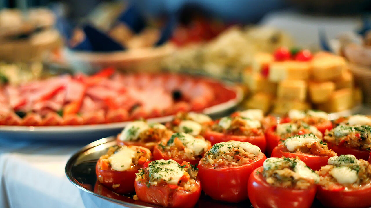 Trays of food are on a table.