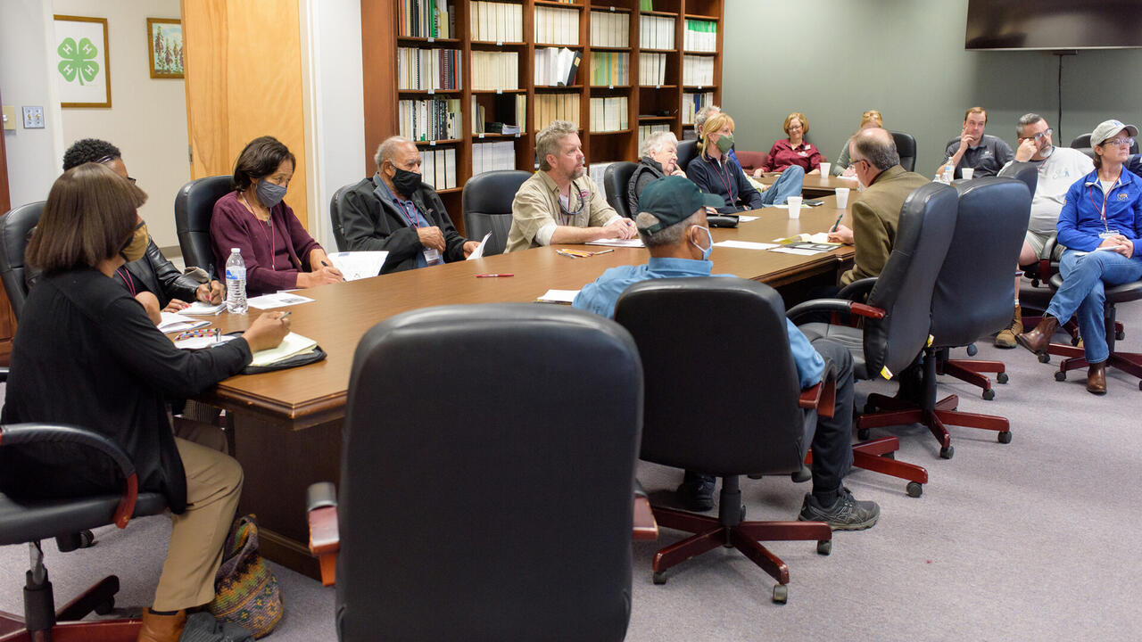 A group of people sitting around a table.