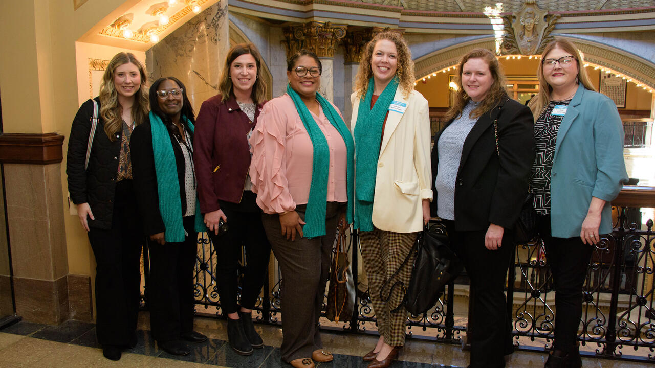 Seven women stand in the Mississippi State Capitol building.