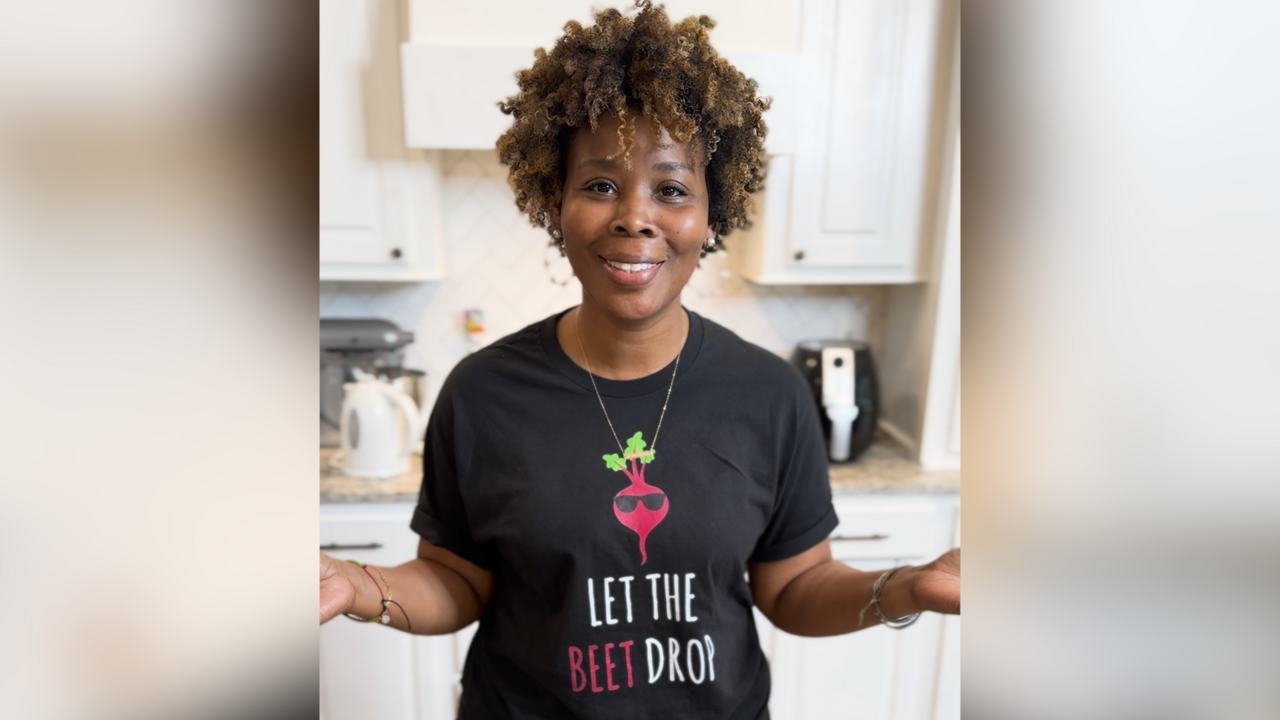 A woman stands in a kitchen