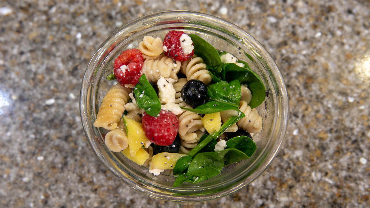 A bowl of Mango Berry Rotini Salad.