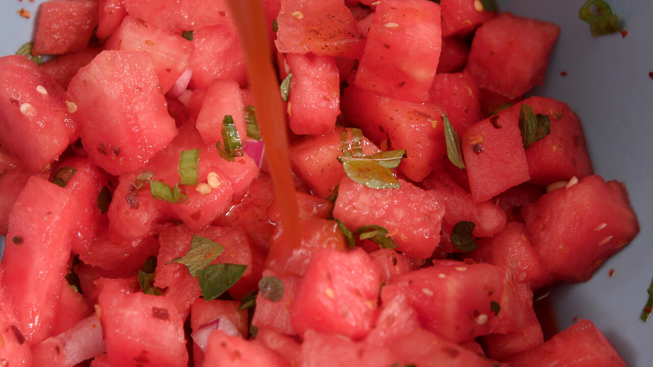 Cubed watermelon with spices and fresh mint.