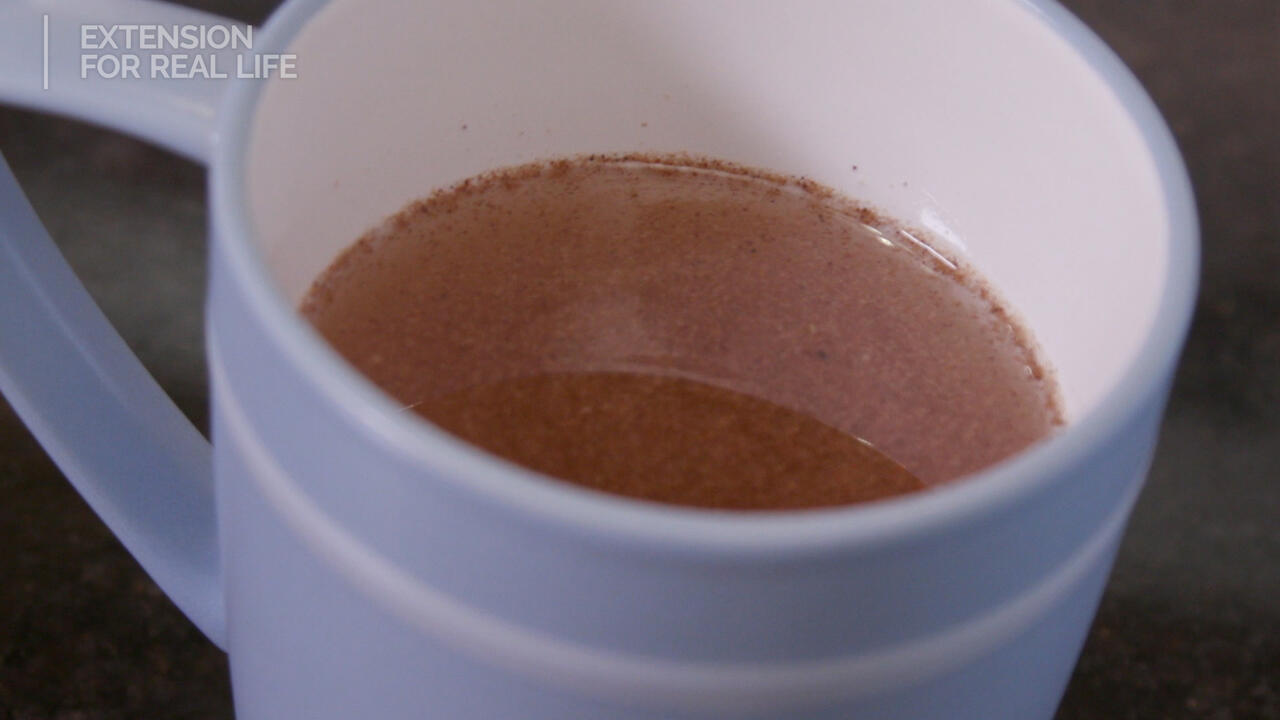 A mug with tea in it.