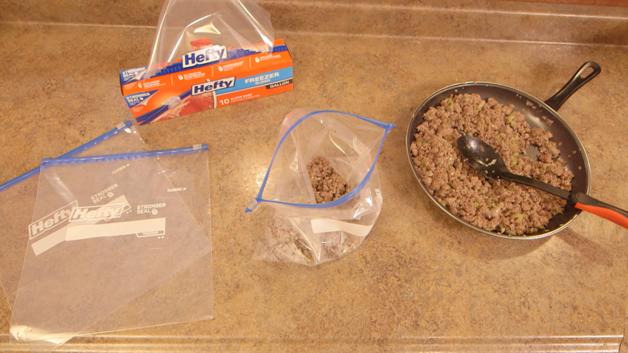 Browned ground beef, chopped onions, celery, and garlic in a non-stick skillet ready to spoon into individual freezer bags.