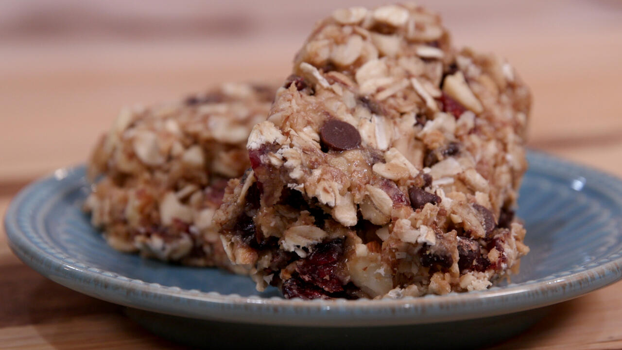 peanut butter chocolate granola squares on a blue-gray plate