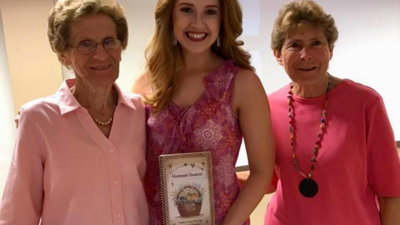 Two women who attended the Breast Cancer Awareness Luncheon pictured with speaker Molly May.  