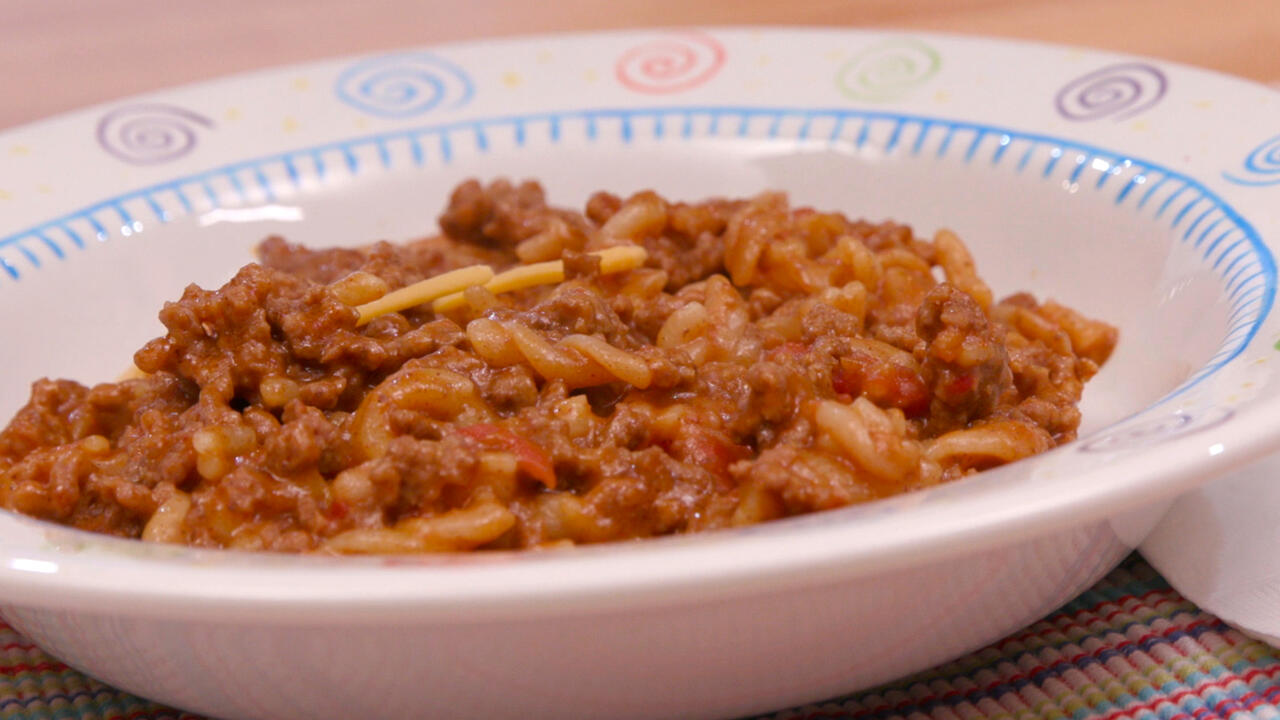 Bowl of Taco-mac, ground beef and macaroni dish.