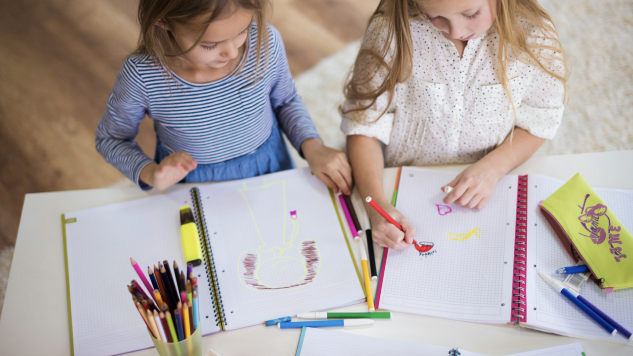 Two girls coloring. 