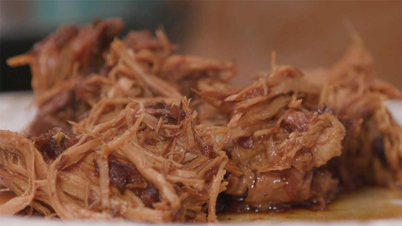 Cooked, shredded pork roast in cranberry sauce.