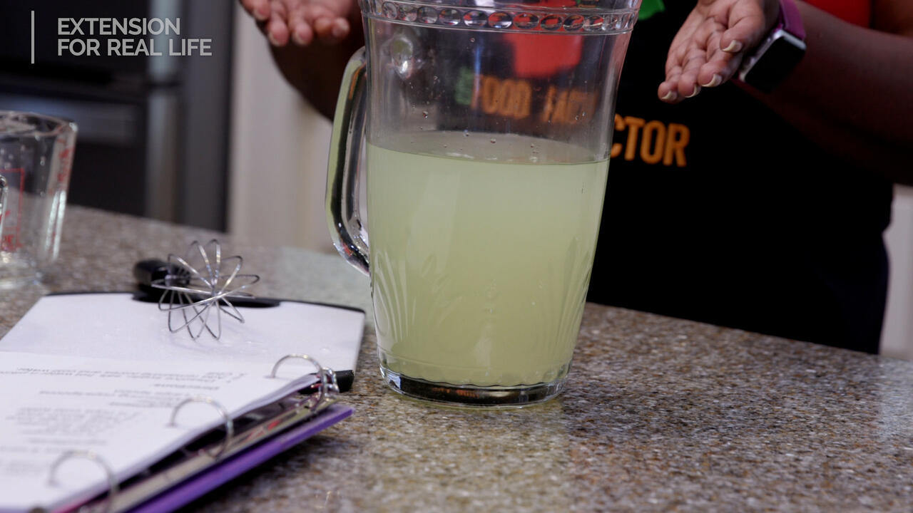 A pitcher of homemade sports drink on a counter