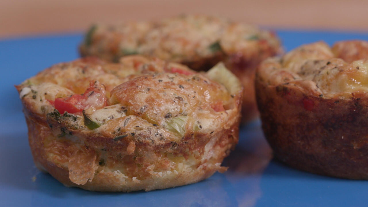 Veggie quiche muffins on a blue plate