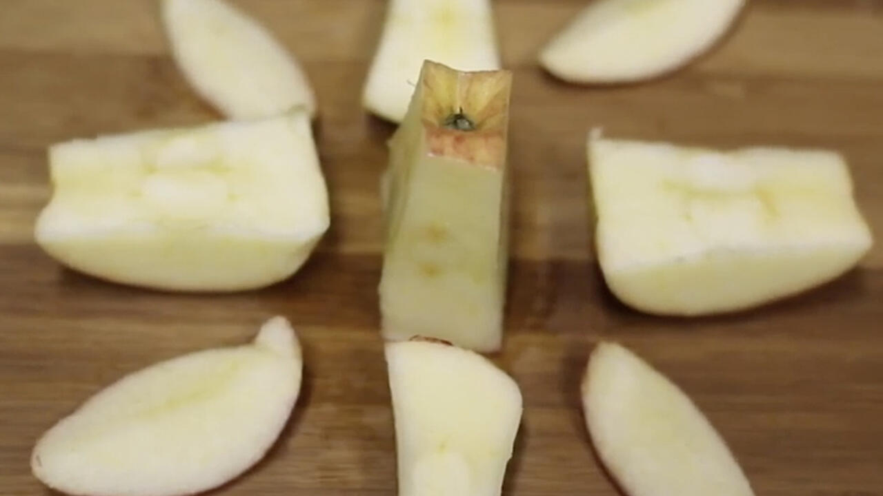 apple slices on cutting board.