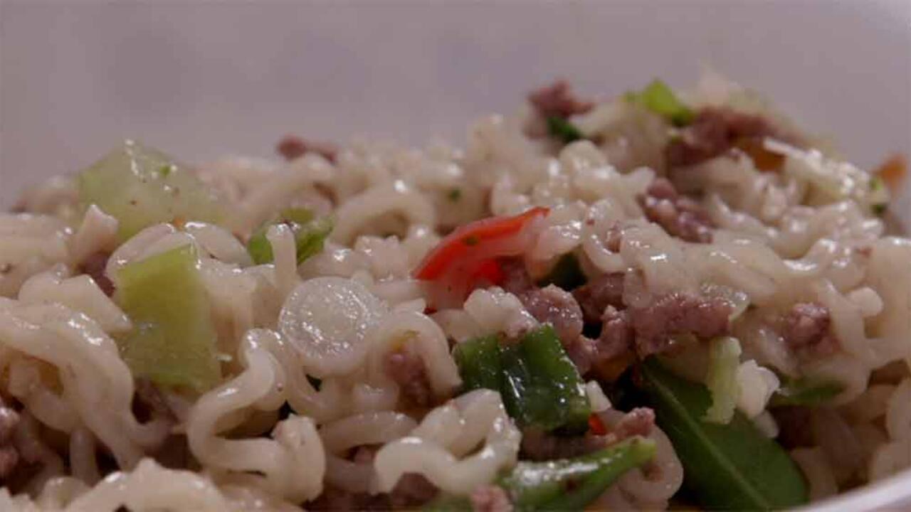 Cooked noodles, vegetables, and beef.