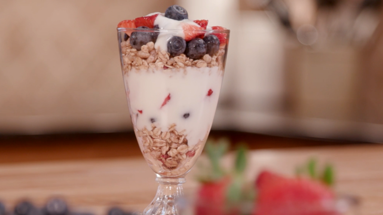 A parfait made of seasonal, locally grown blueberries, strawberries, granola, and yogurt.