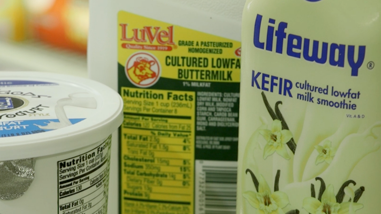 A product display of Greek yogurt, buttermilk and kefir.