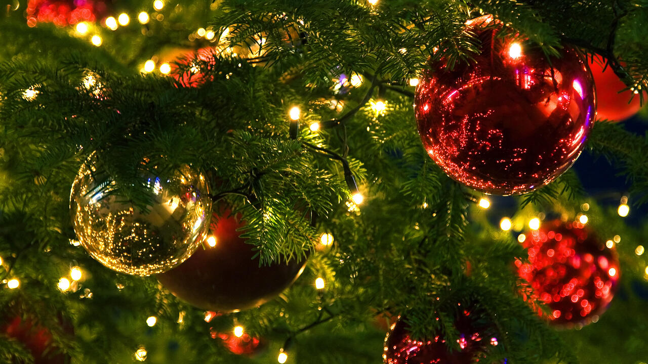 Closeup of ornaments and lights on a Christmas tree