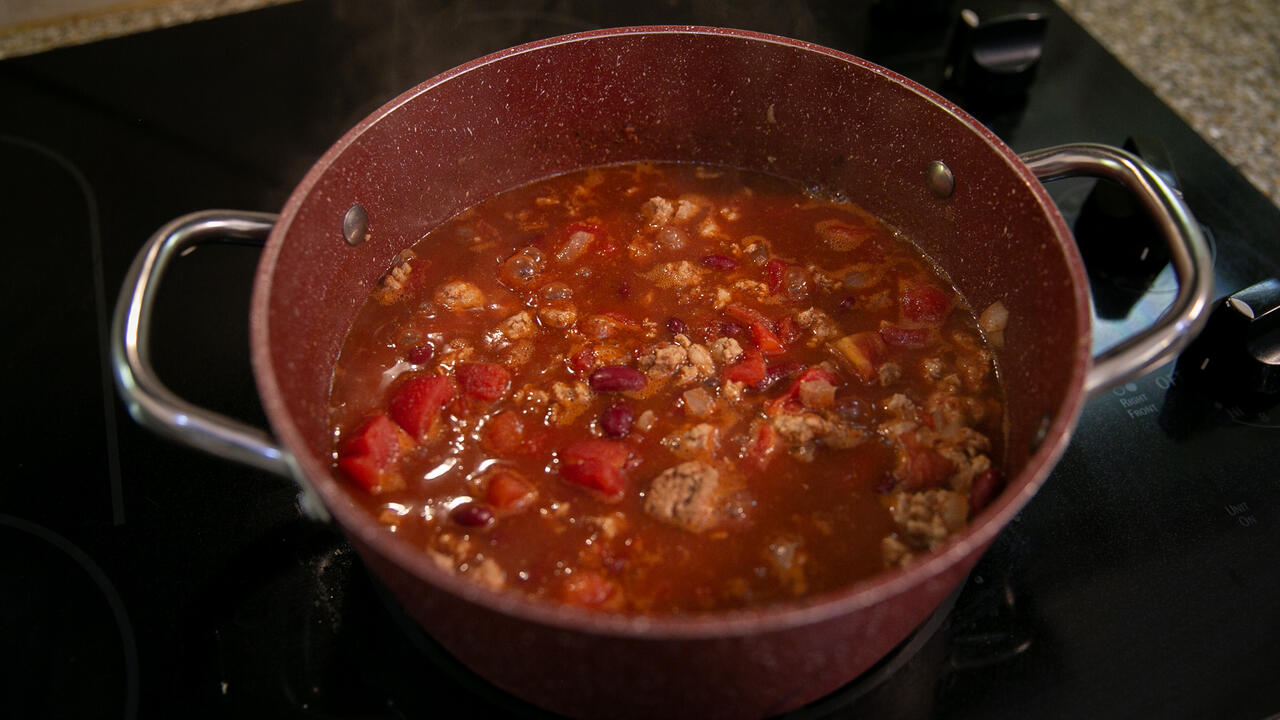 A pot of Quick Chili sits on the stove.