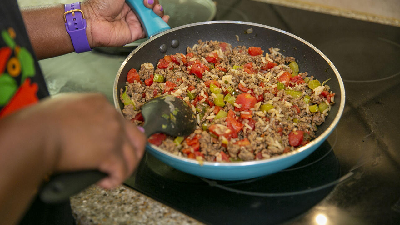 Mighthy Skillet Meal cooking in a skillet on the stove.