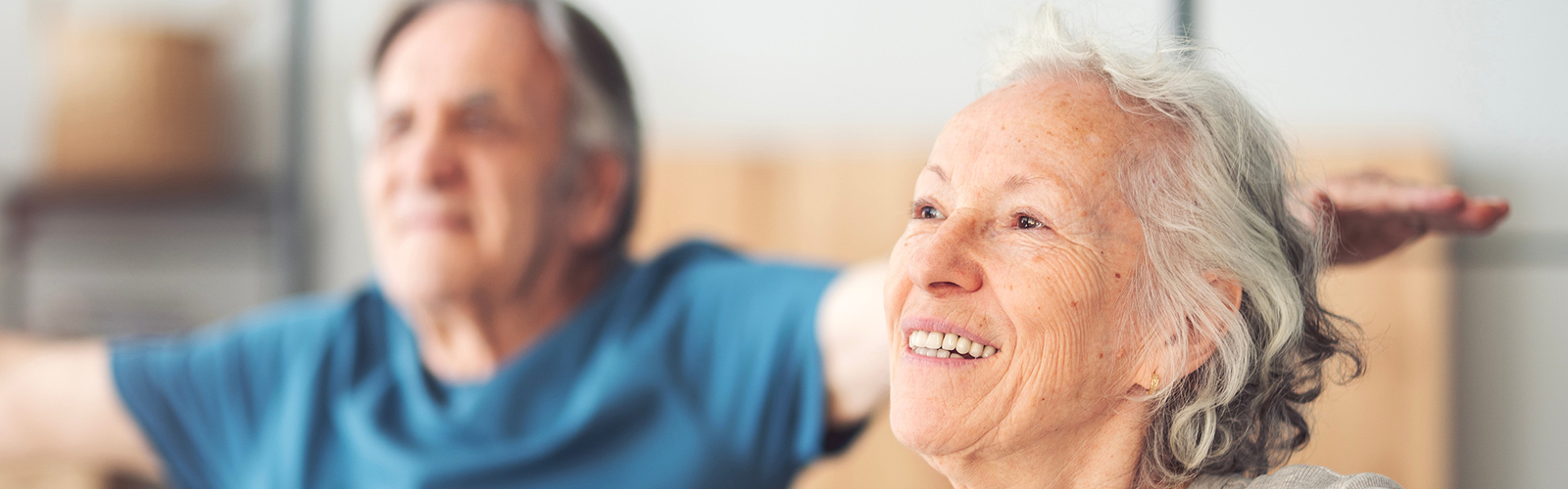 Photo of two people exercising.