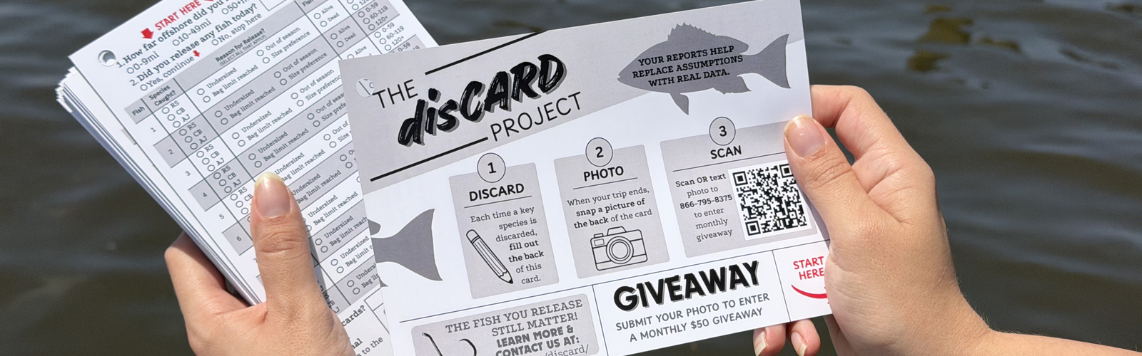 Hands holding project survey cards and an instructional card with a QR code near a dock.