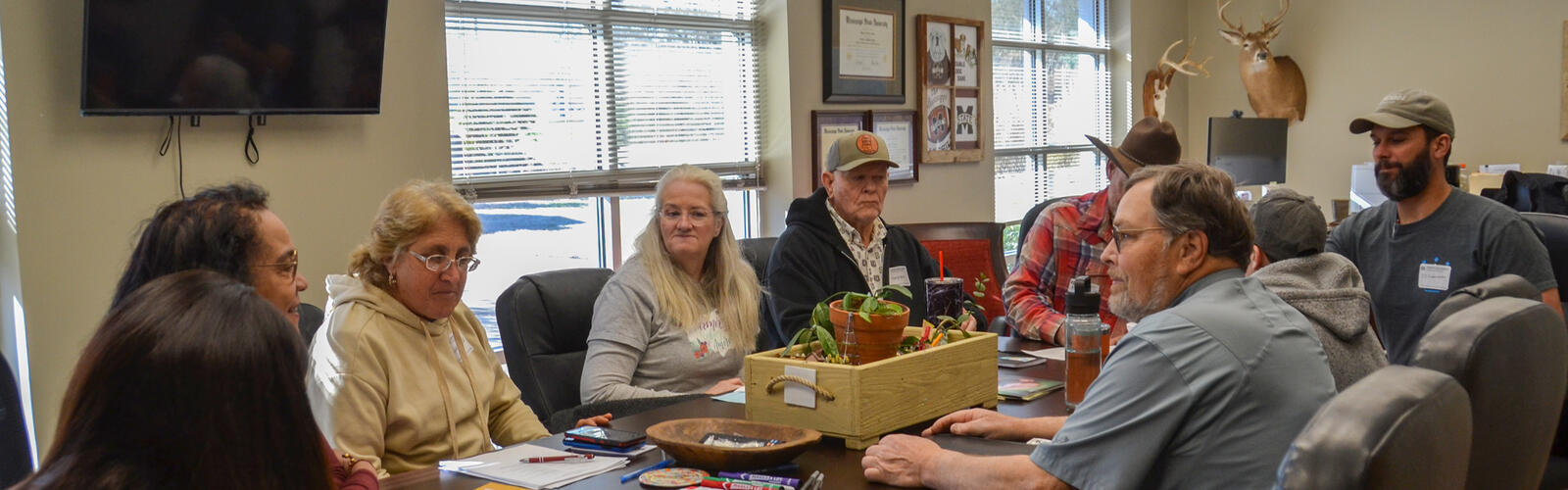 People sit around a table.