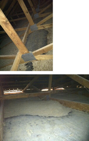 Attic view shows beams and joists with insulation piled up in some areas and completely missing in others.