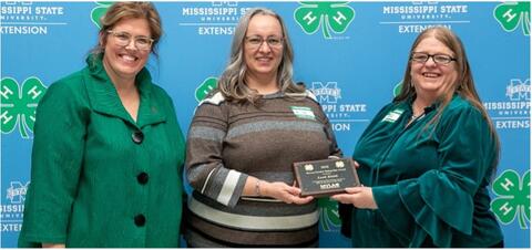 Dr. Mariah Morgan and Connie Darden present Leah Smith with an award