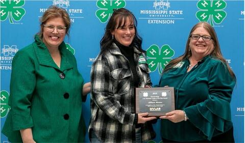 Connie Darden and Dr. Mariah Morgan present Allison Beene with an award