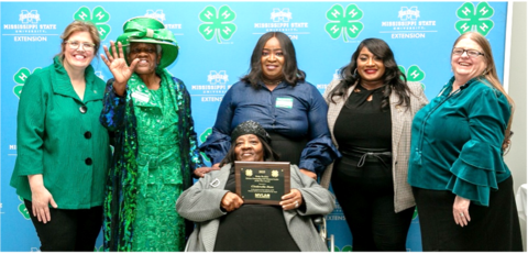 Cinderella Ross is presented with an award