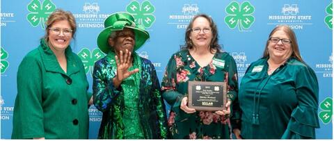 Shirley Breland is presented with an award