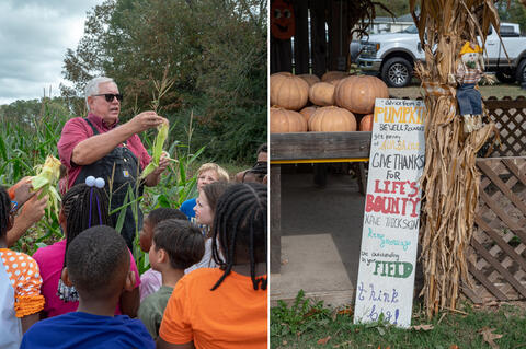 A man in overalls and holding an ear of corn in a cornfield while a large group of children looks on; a sign listing “Advice from a Pumpkin,” including “Be well rounded; get plenty of sunshine; give thanks for life’s bounty; have thick skin; keep growing; be outstanding in your field; think big!”