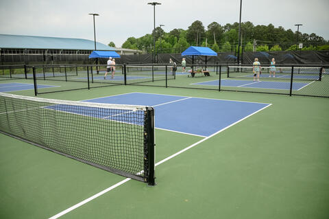 People playing pickleball.