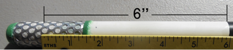 PVC pipe with sensor attached to one end and black electrical tape at the other end. A ruler shows the distance between the two is 6 inches.
