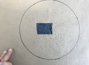 A circle is drawn around the target point on the heaviest concentration of pellets.  
