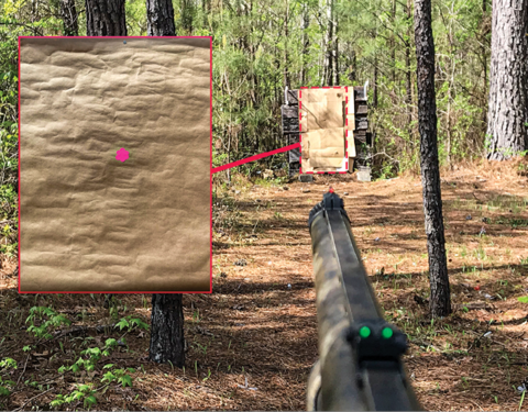 A rifle is pointed toward a target some distance away. In the overlay is a close-up of the paper with the point of aim.