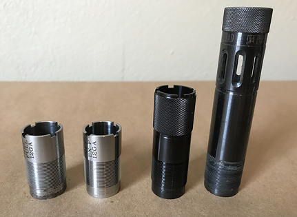Four chokes of various sizes are on a table.