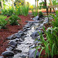 rock lined drainage swale from parking lot