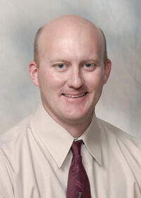 Mr. T. Adam Tullos