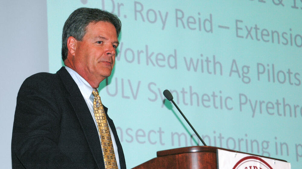 A person standing at a podium.