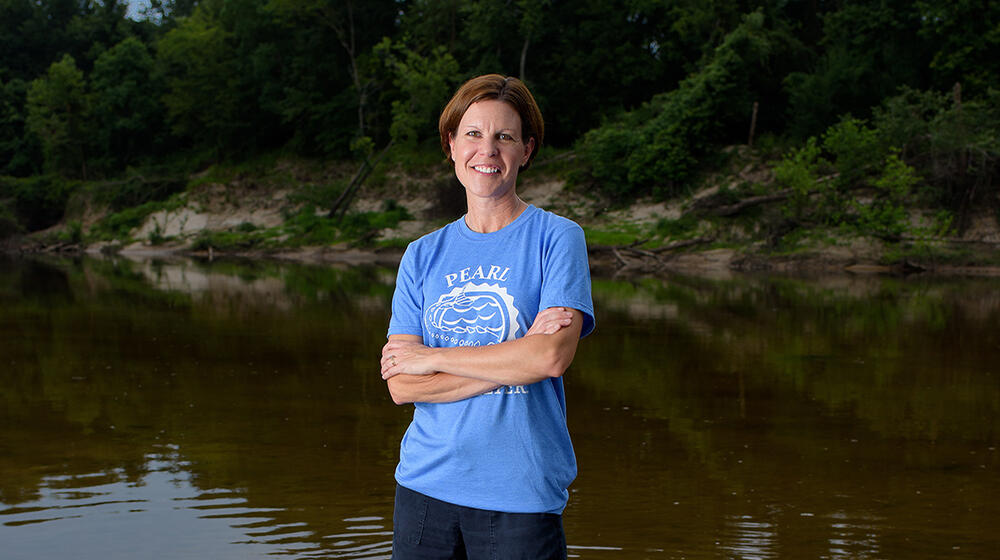 Abby Braman standing in a creek.